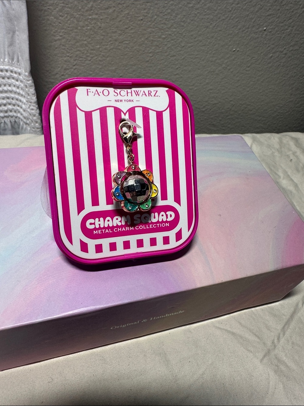 FAO Schwarz Spinning Disco ball with Multicolor Flower Charm NWT